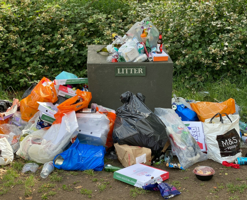 garbage bags on green grass field